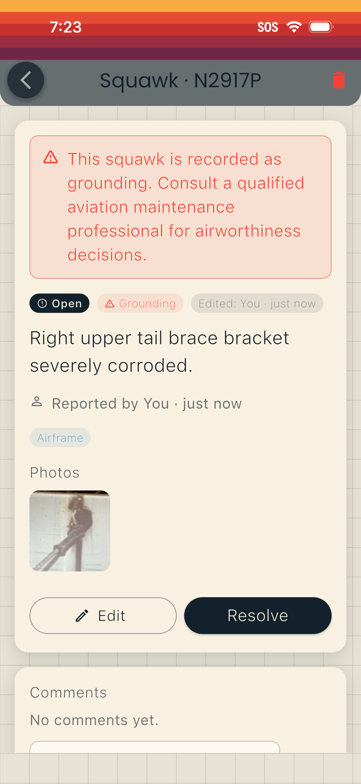 Squawk detail screen: an open grounding squawk for a corroded tail brace bracket, with a photo, an Airframe tag, and Edit and Resolve buttons